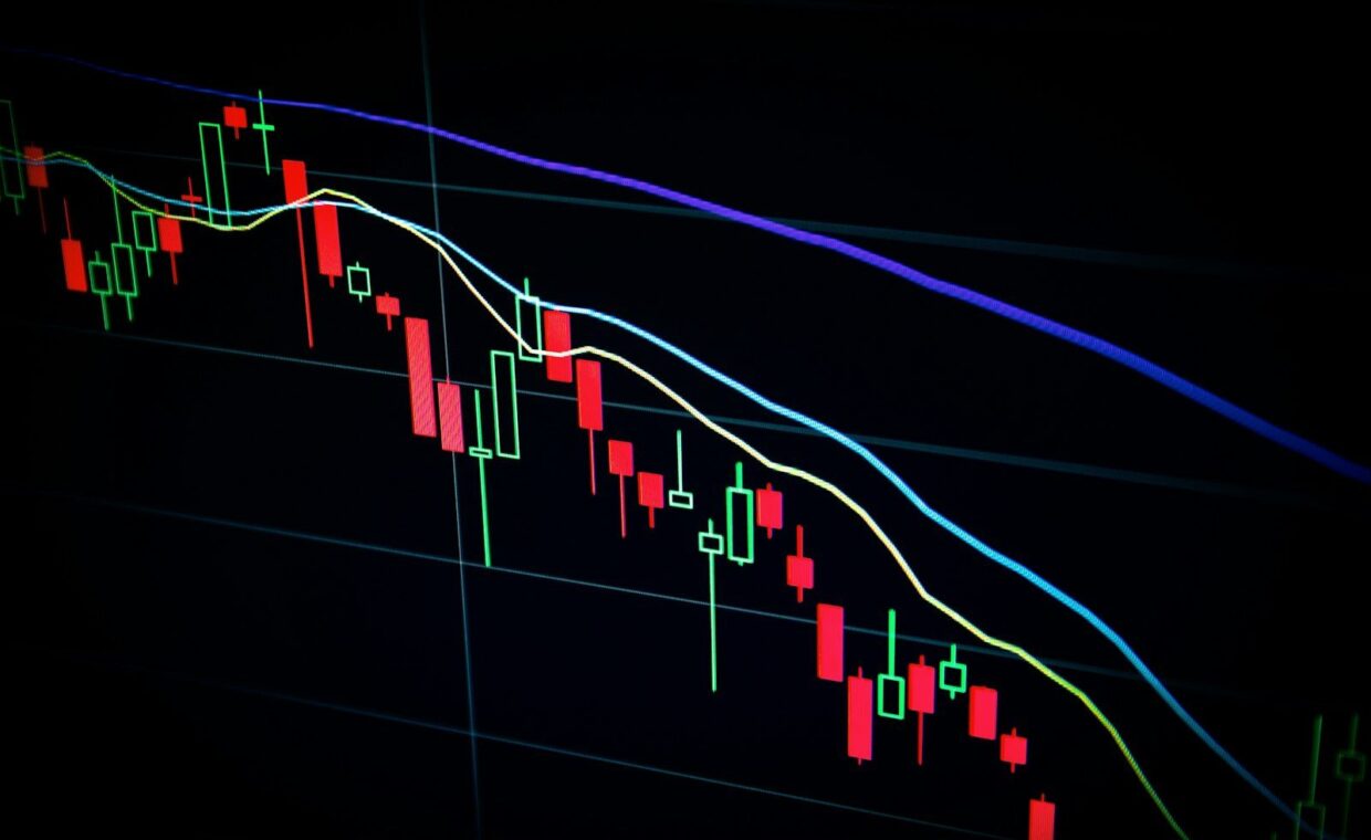stock market candlestick chart on dark screen