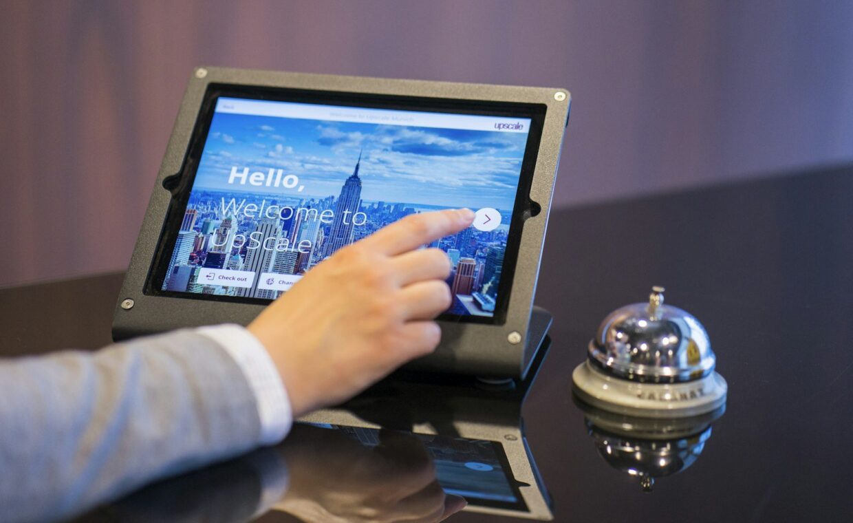 person about to touch black Android tablet computer