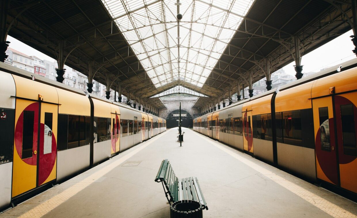 green metal train station bench