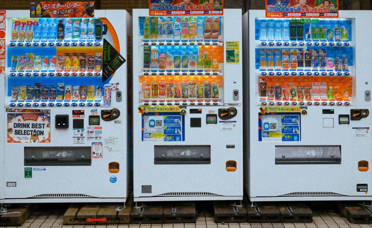 Colorful Japanese vending machines filled with a variety of drinks. Captured outdoors in Japan.