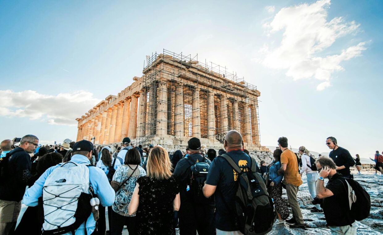 Tourists gather at the historic Parthenon in Athens, Greece, a UNESCO World Heritage site.