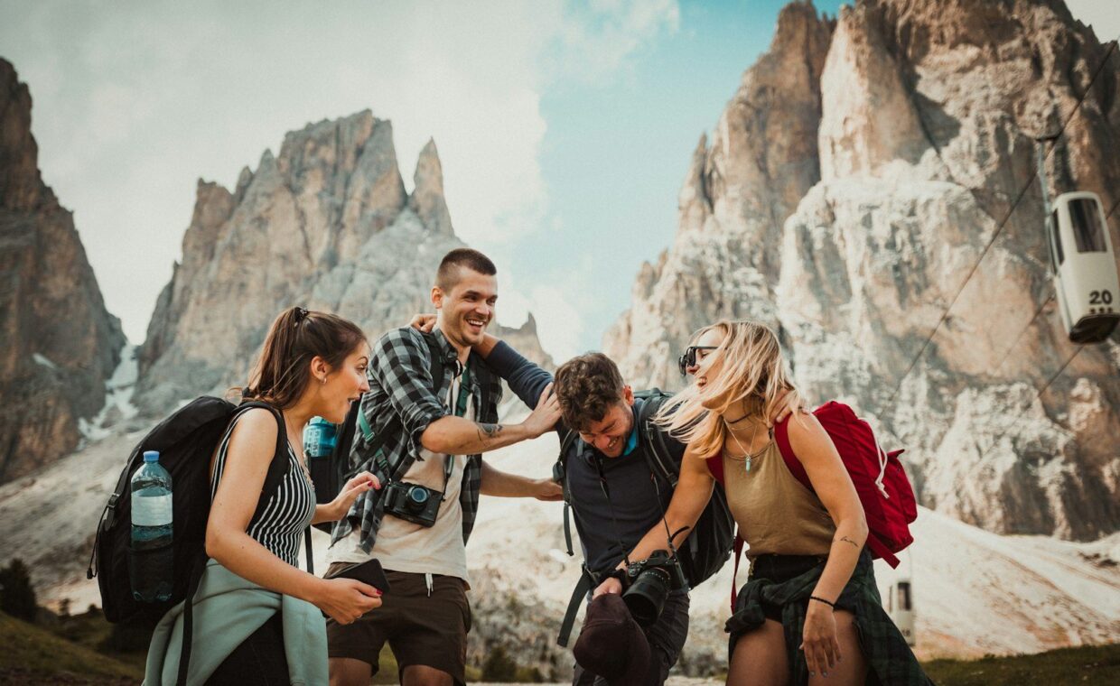 low-angle photography of two men playing beside two women